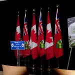 Speaker's corner with exhibit posters -"a Tree for Every Hero" shown on right.